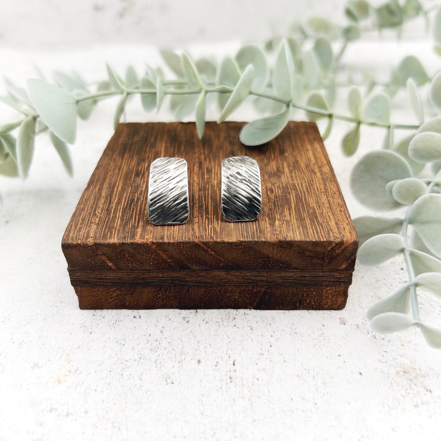 Sterling silver textured oblong studs