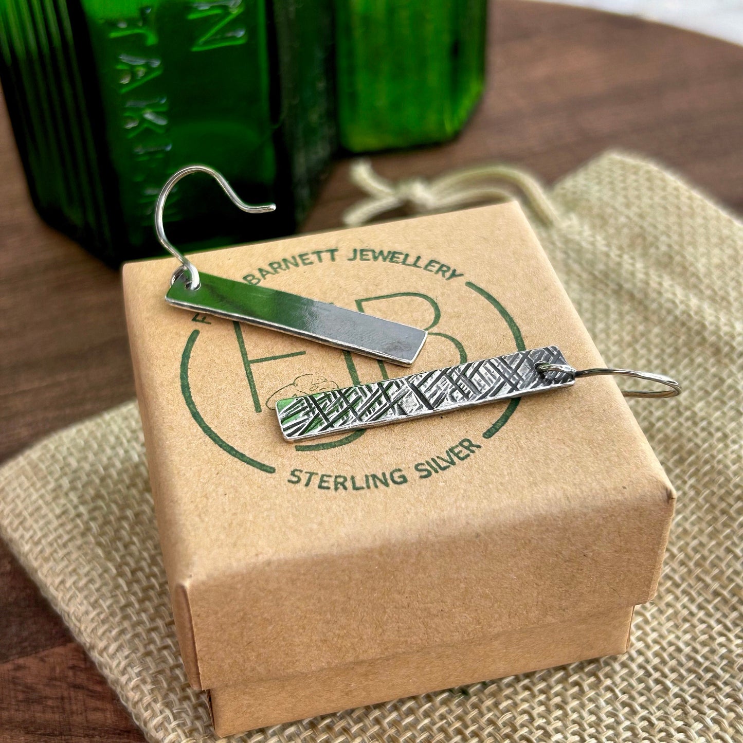 Sterling silver cross hatch textured dangle earrings